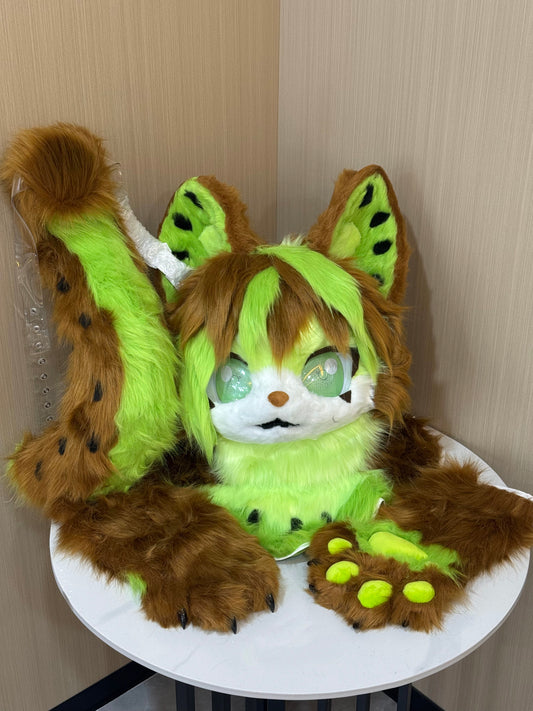 Brown and lime green leopard cat fursuit head with paws and spotted tail