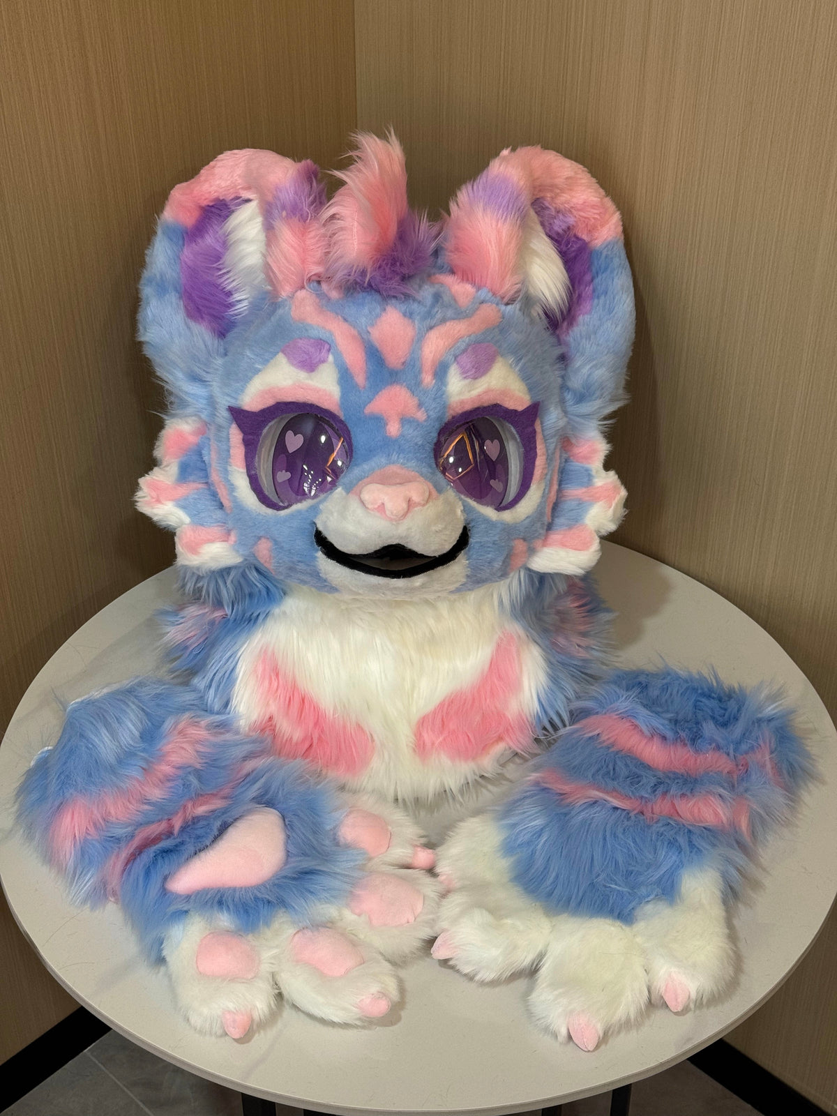 Pastel blue pink and white cat fursuit head with matching arm paws
