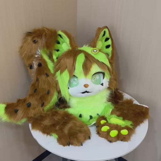 Brown and lime leopard cat fursuit head and paw detail — video