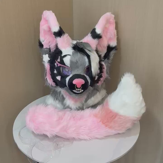 Pink and black cat fursuit hand paws and tail detail — video