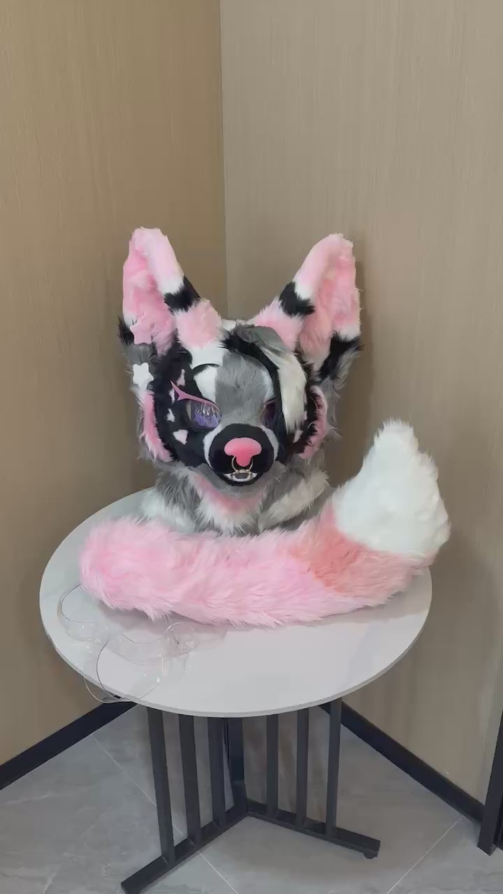 Pink and black cat fursuit hand paws and tail detail — video